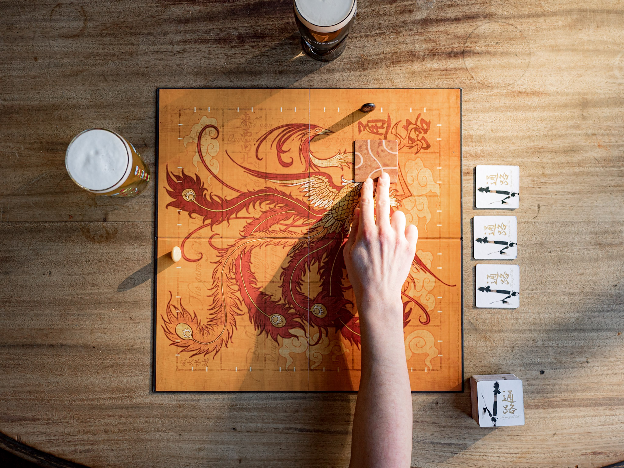 Friends enjoying a board game night at a stylish Brighton venue