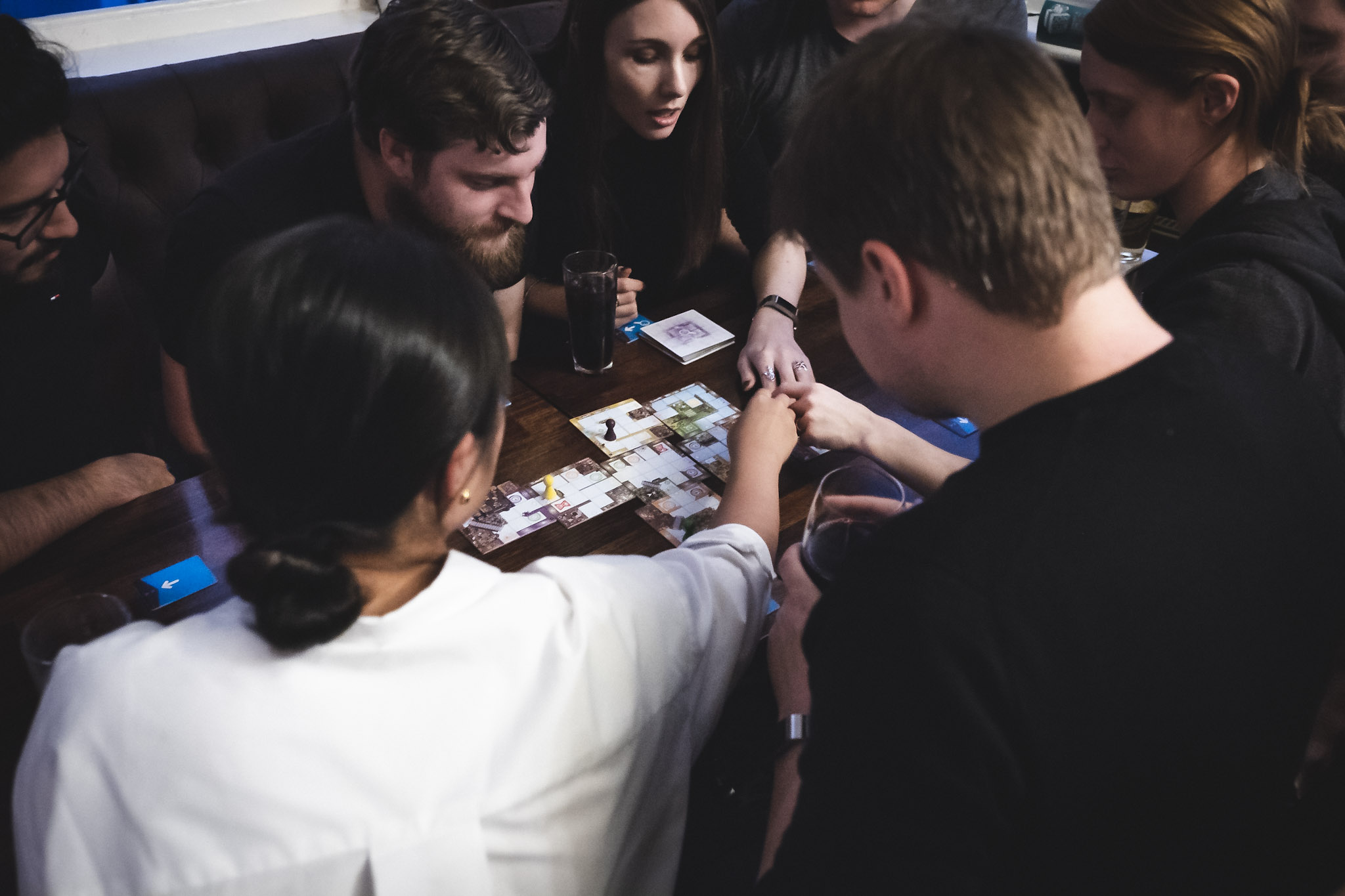 Friends playing board games at a pub